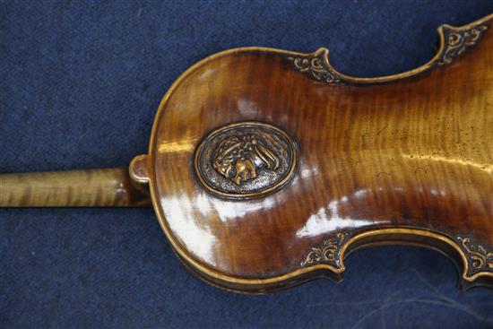 A decorative violin, bearing Gaspar da Salo label, body 14.5in., overall 23.5in., cased with a bow